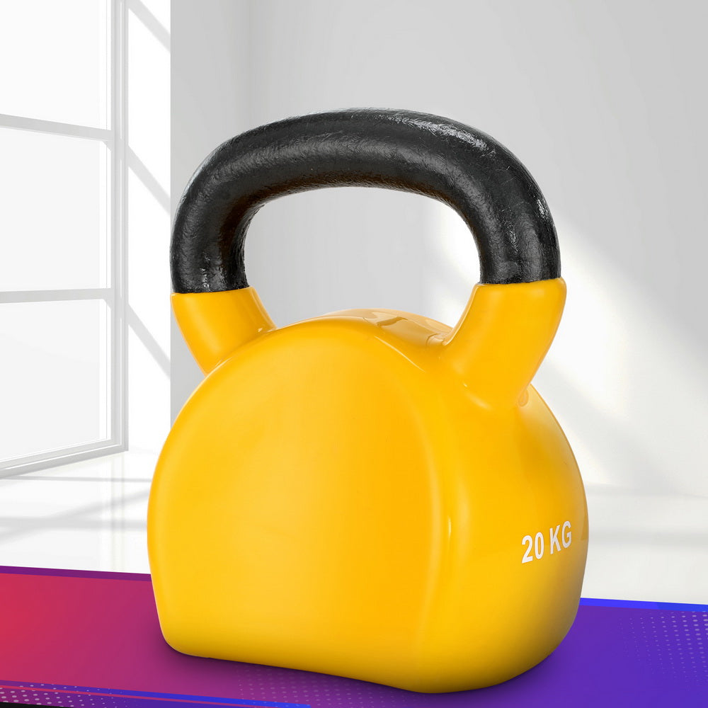 Yellow kettlebell with black handle on a purple and white striped surface