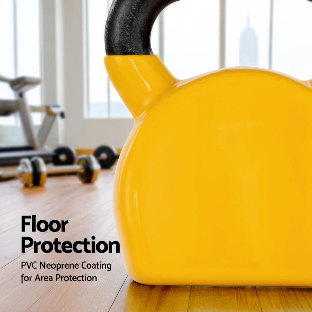 Yellow kettlebell on a wooden floor with gym equipment in the background, emphasizing floor protection.