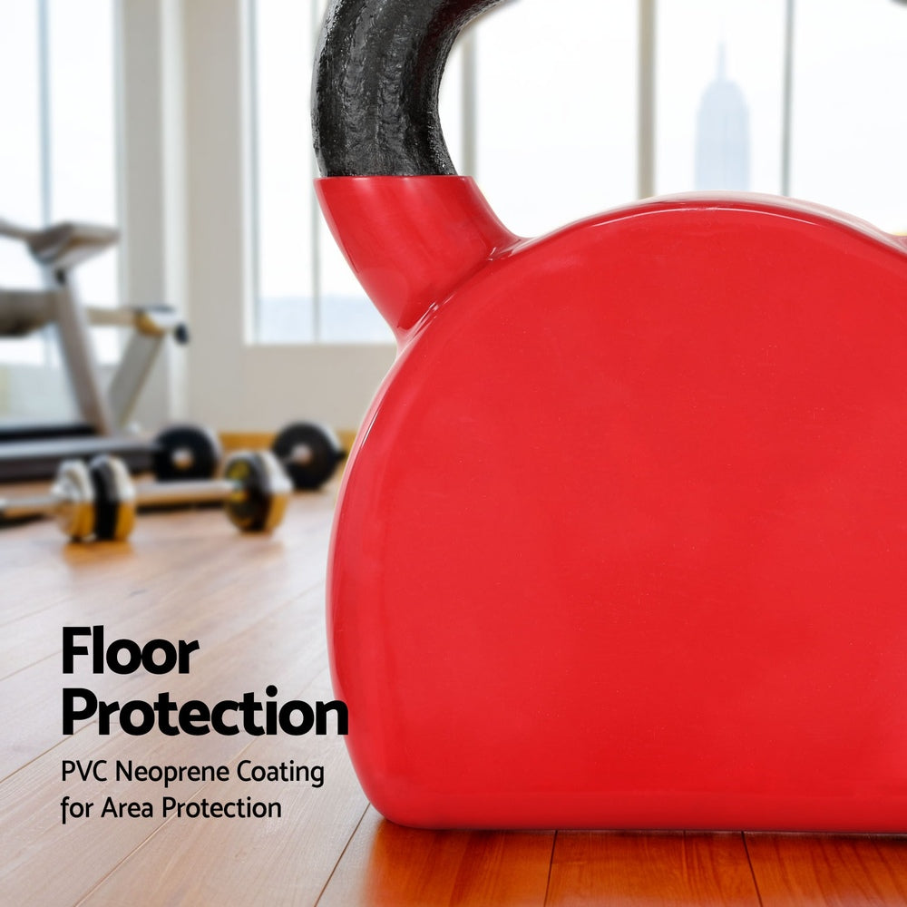 Everfit 24kg kettlebell in red placed on gym floor with other workout equipment.