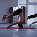 Gym user on mat 