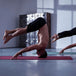 Gym user on mat 