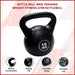 Black kettlebell with '16 KG' marking on a light pink background