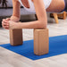 Woman leaning on 2 Yoga blocks 