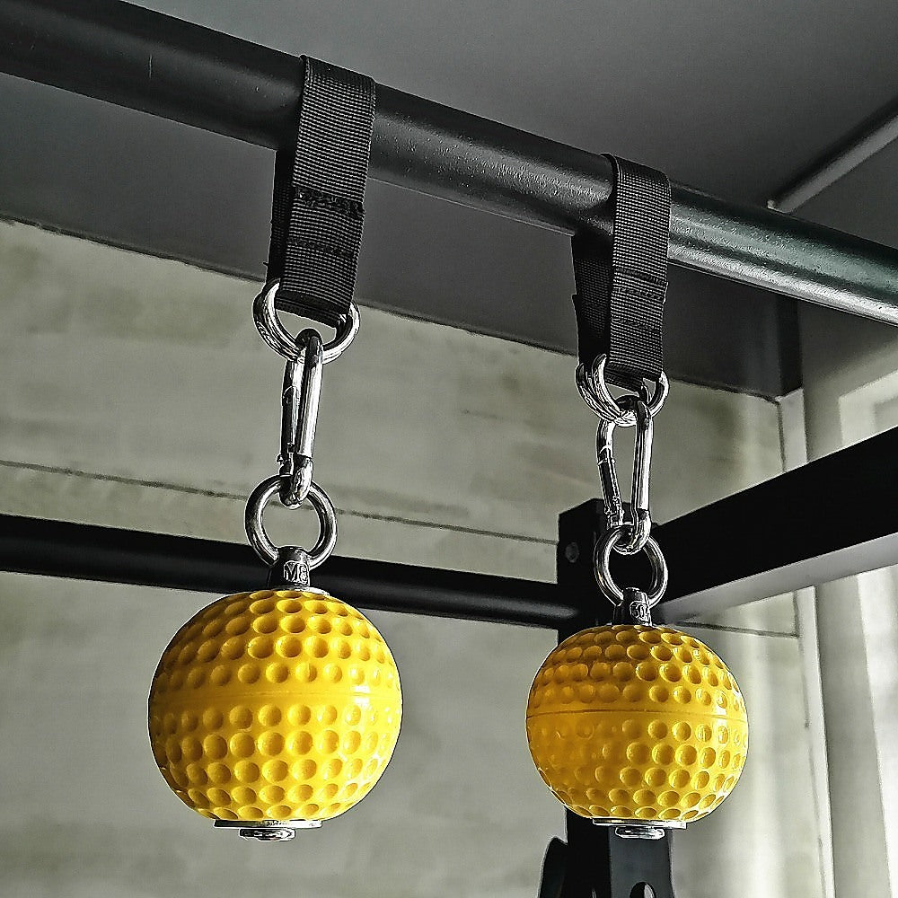 balls strapped to gym frame 